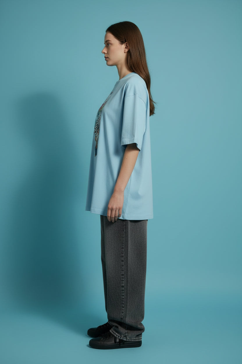 ZotRage baby blue heavyweight cotton oversized t-shirt featuring a graphic of a meditating man with Stay Positive text