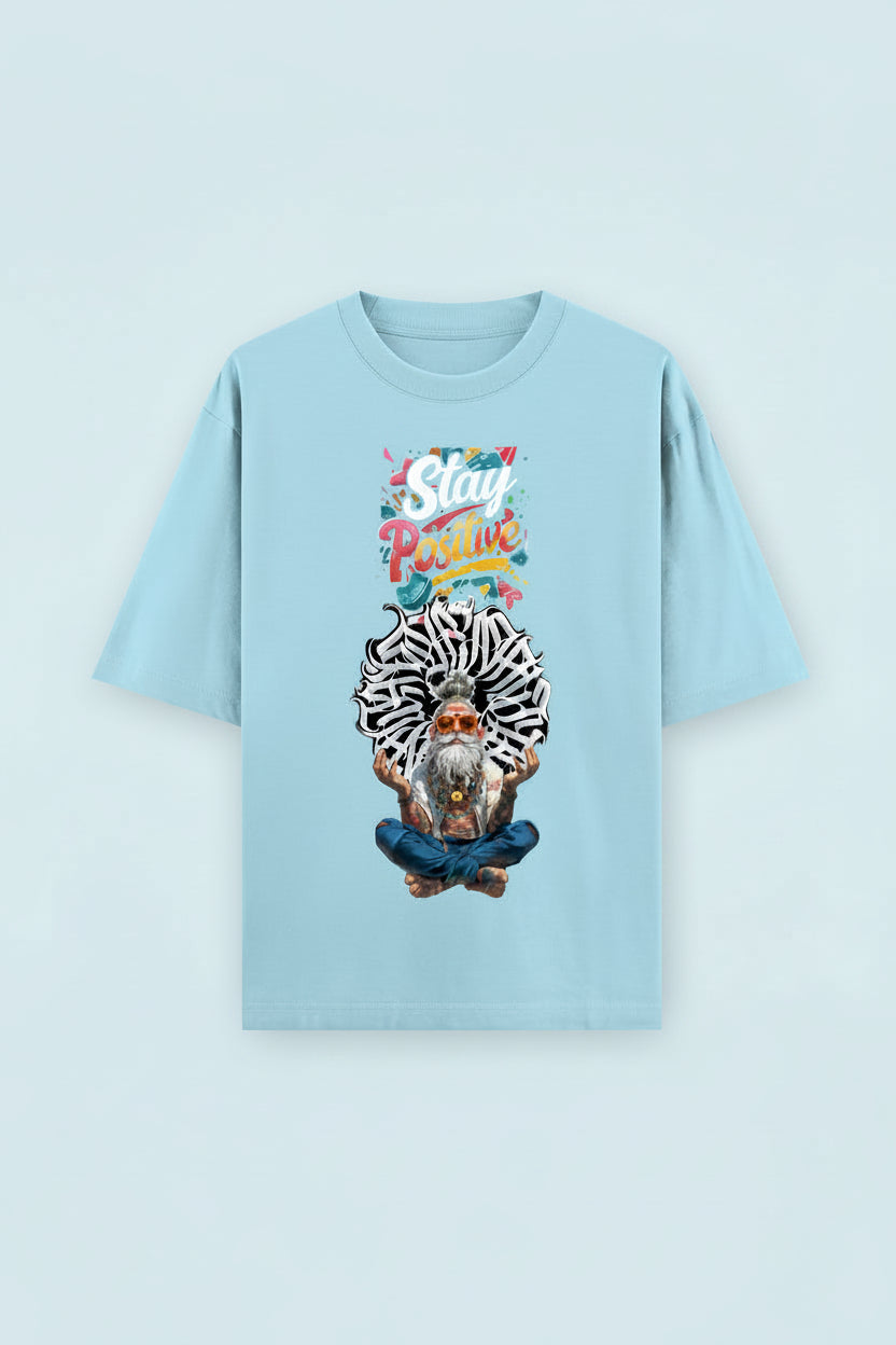 ZotRage baby blue heavyweight cotton oversized t-shirt featuring a graphic of a meditating man with Stay Positive text