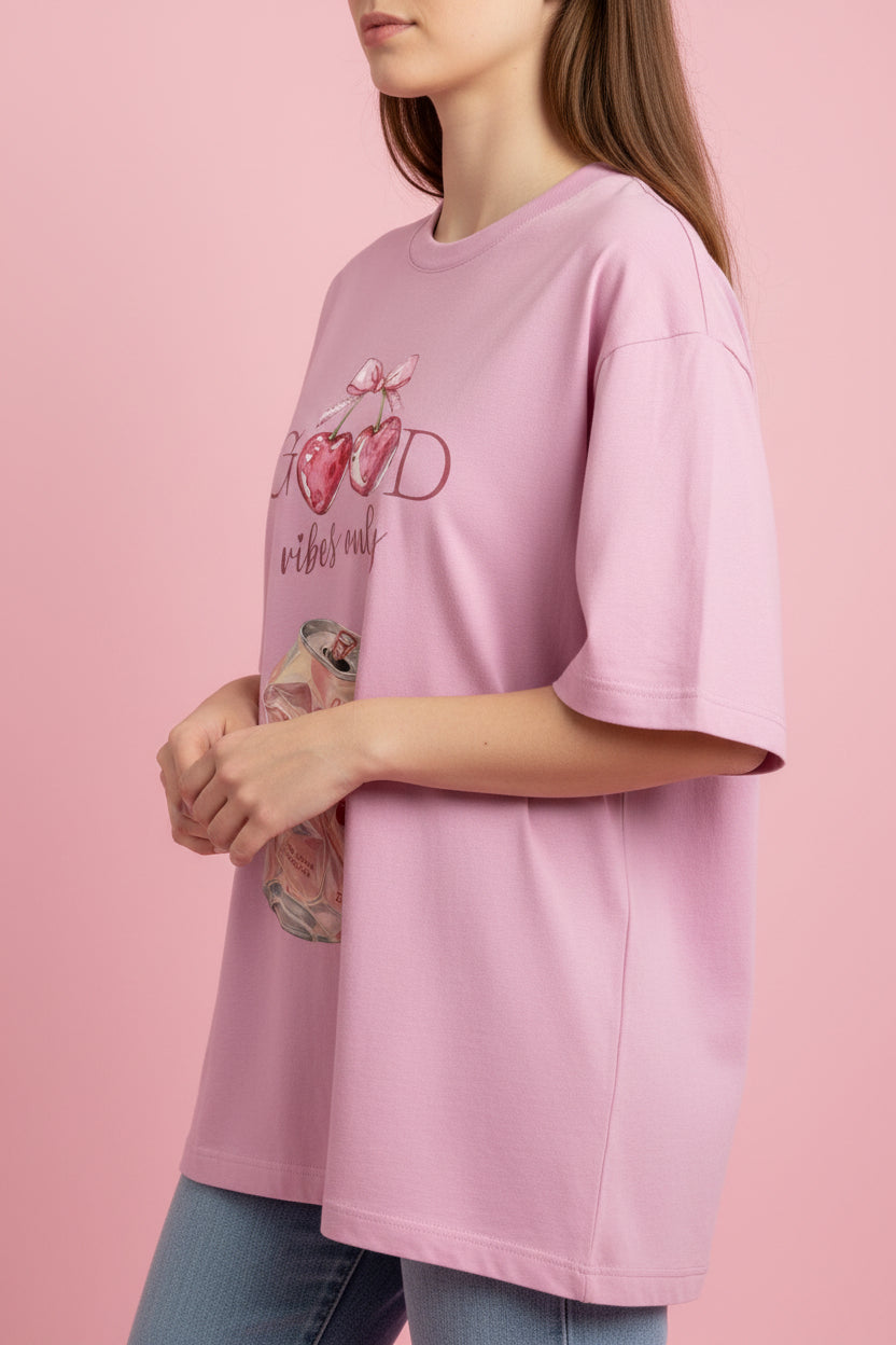 ZotRage baby pink oversized t-shirt featuring a cherry soda can graphic and Good Vibes Only text print.