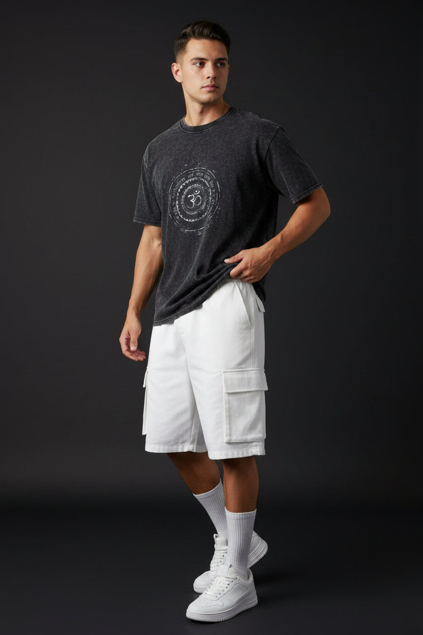 ZotRage black acidwash oversized t-shirt with a white circular Om symbol graphic print on the chest.