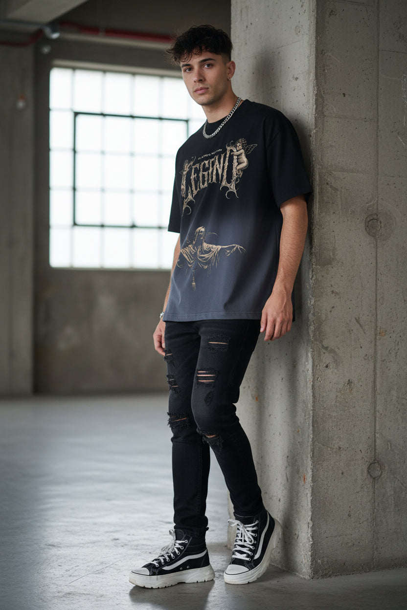 ZotRage black ombre boxy fit t-shirt featuring a vintage-style Legend graphic with cherubs and a grim reaper figure.
