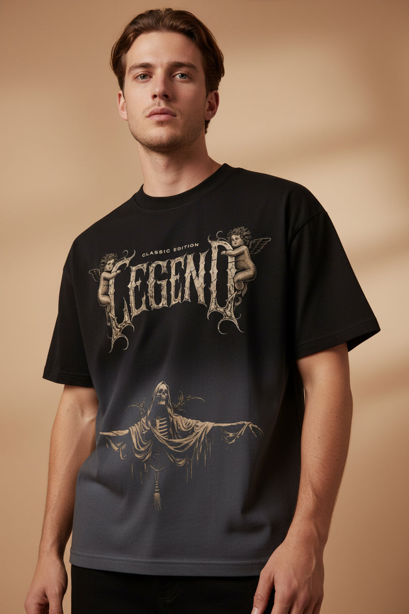 ZotRage black ombre boxy fit t-shirt featuring a vintage-style Legend graphic with cherubs and a grim reaper figure.