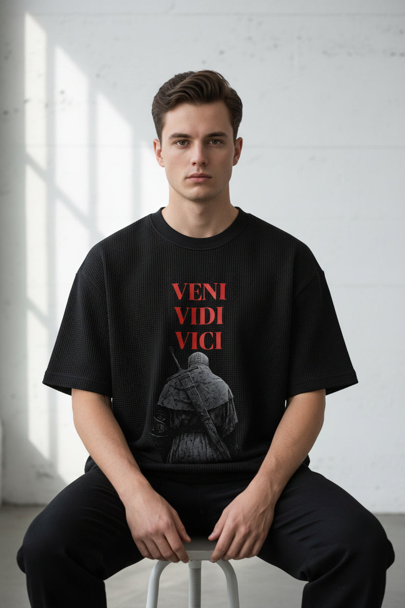 ZotRage black waffle knit boxy t-shirt featuring a graphic of a knight and red Veni Vidi Vici text on the chest.