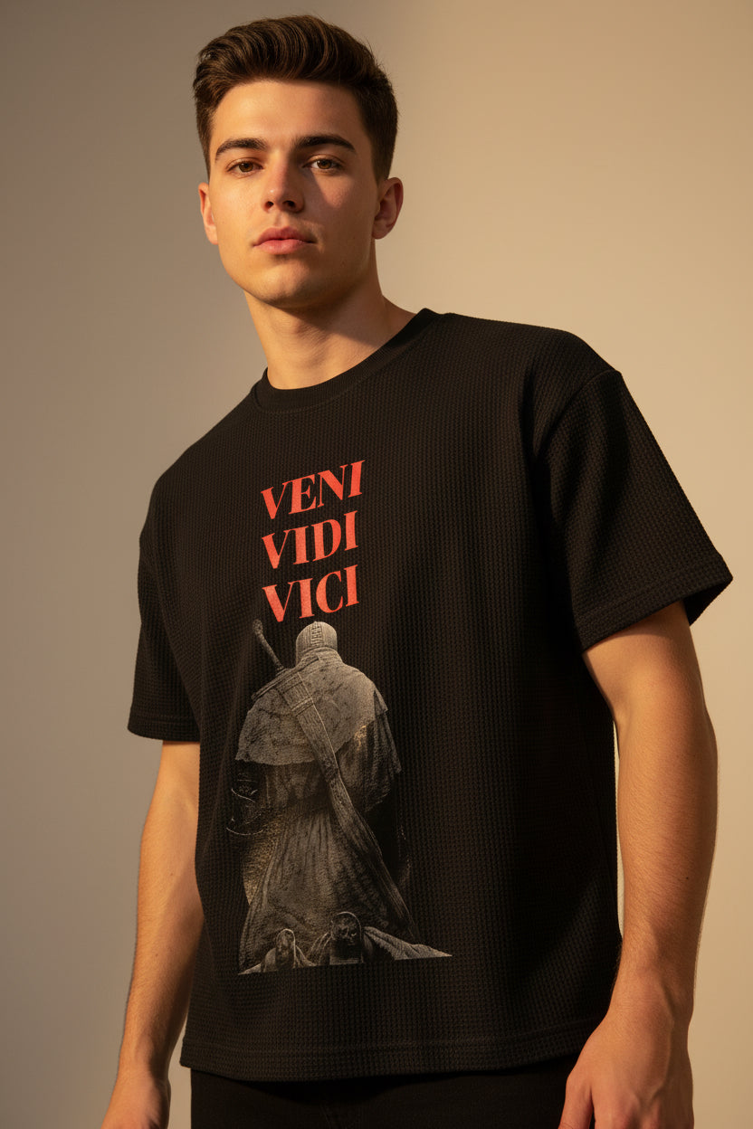 ZotRage black waffle knit boxy fit t-shirt featuring a graphic print of a knight and the text Veni Vidi Vici in red.