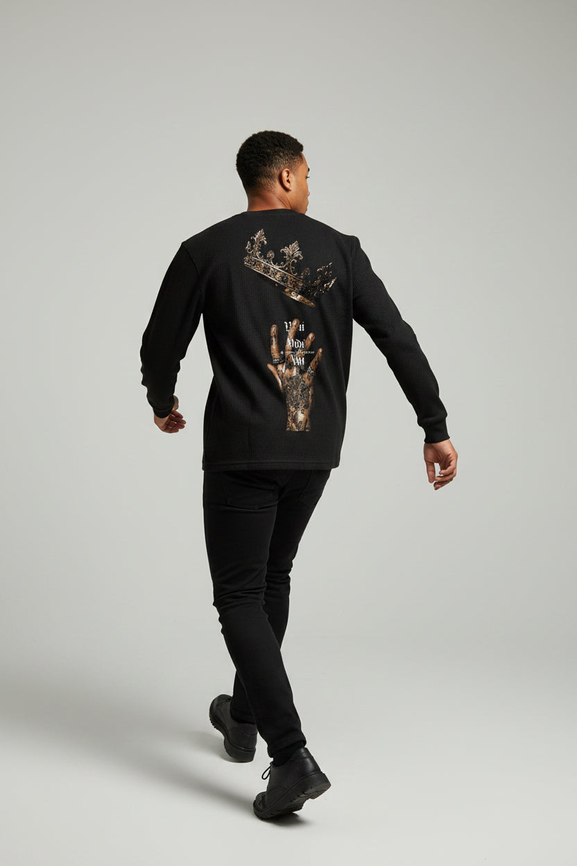 ZotRage black waffle knit long-sleeve shirt featuring a crown and tattooed hand graphic on the back