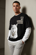 ZotRage black oversized waffle-knit tee with white long sleeves, featuring a white lion graphic and text print.