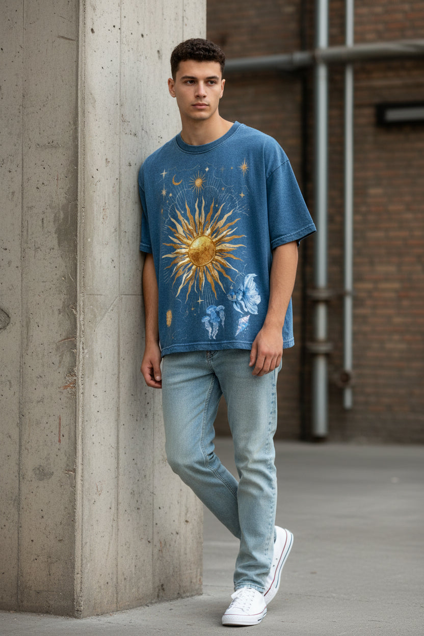 ZotRage blue denim wash boxy fit t-shirt featuring a celestial sun, moon, and jellyfish graphic print.
