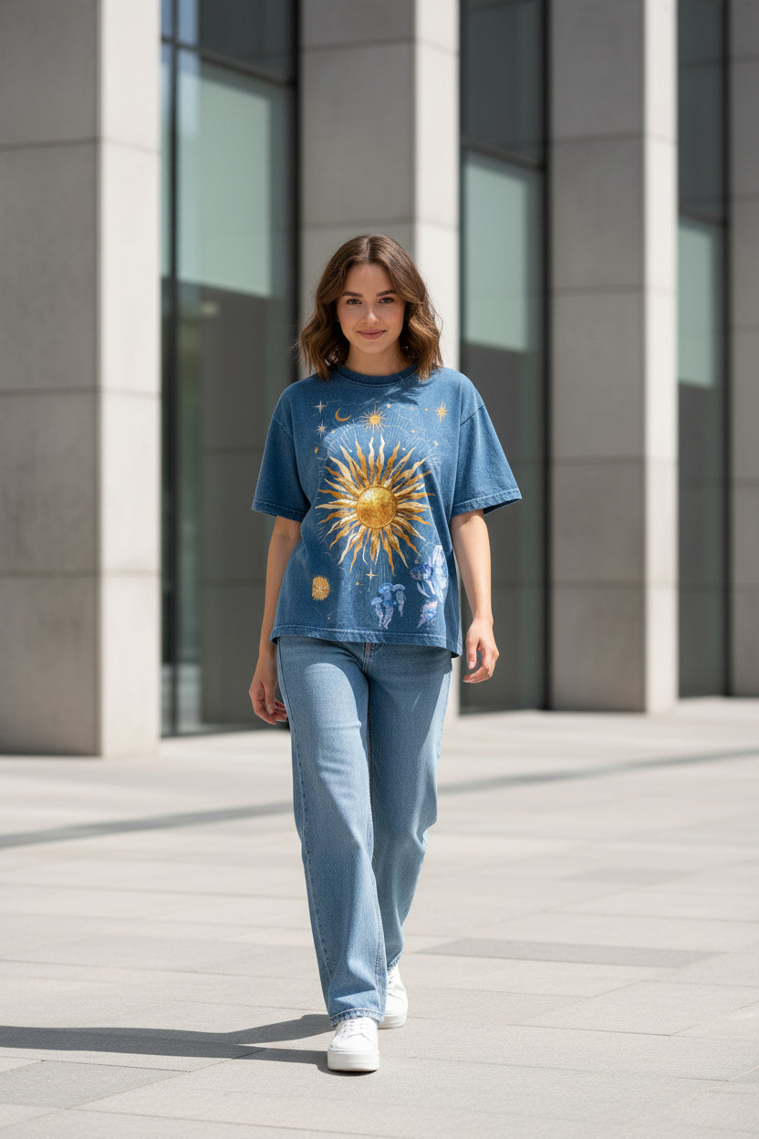 ZotRage boxy fit blue denim wash t-shirt featuring a celestial sun, moon, and jellyfish graphic print.