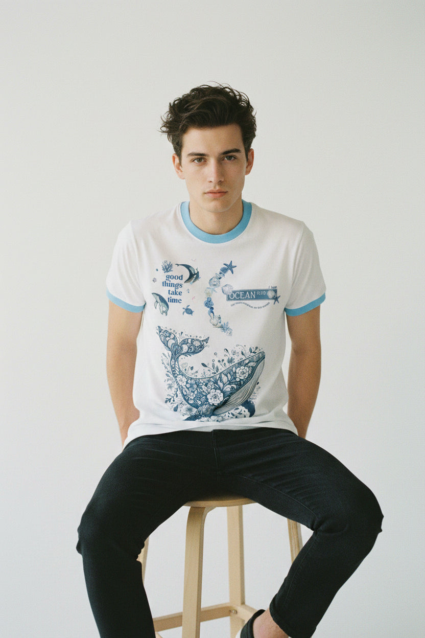 ZotRage white ringer t-shirt with blue trim and a detailed blue floral whale graphic with ocean-themed text