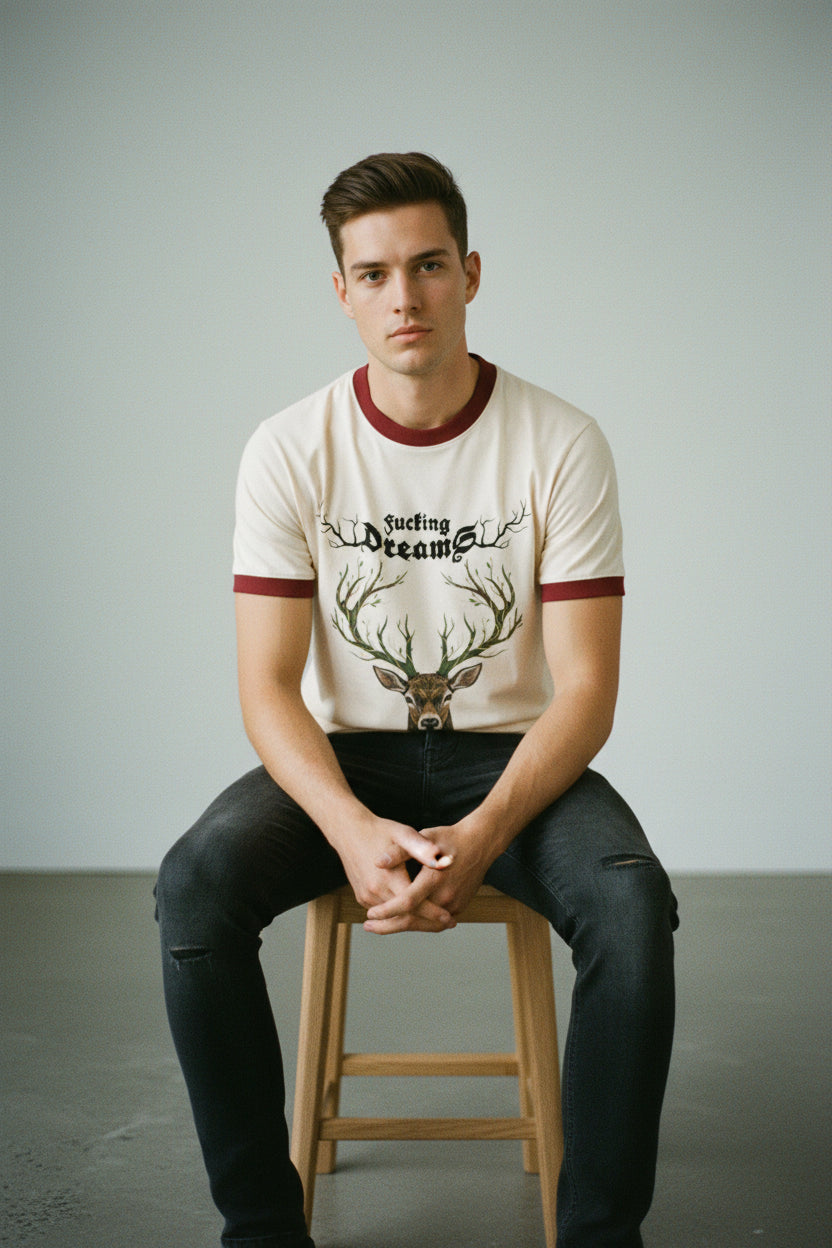 ZotRage cream ringer t-shirt featuring a detailed brown deer head graphic with antler branches and text.