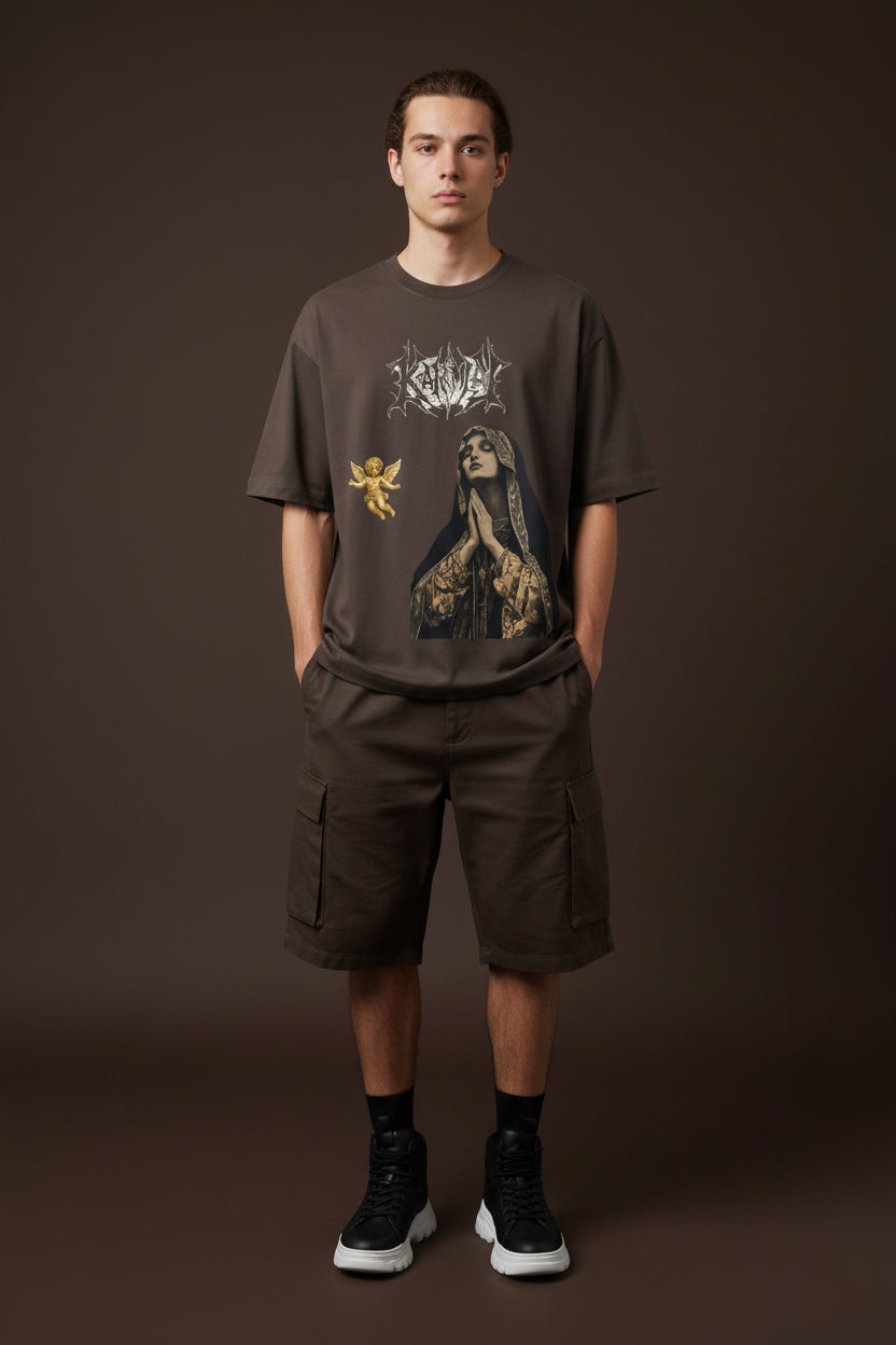ZotRage brown oversized t-shirt featuring a Karma graphic, a praying woman, and a small gold cherub print.