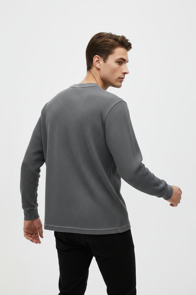 ZotRage charcoal grey acidwash waffle knit long sleeve shirt with a relaxed oversized fit and textured cotton weave.