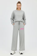 ZotRage grey cotton joggers featuring a wide-leg fit and pink No More Love graphic print on the hip