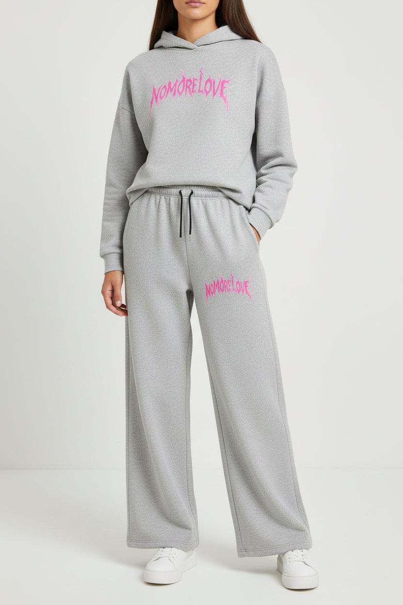 ZotRage grey cotton joggers featuring a pink No More Love graphic print and a black drawstring waistband.