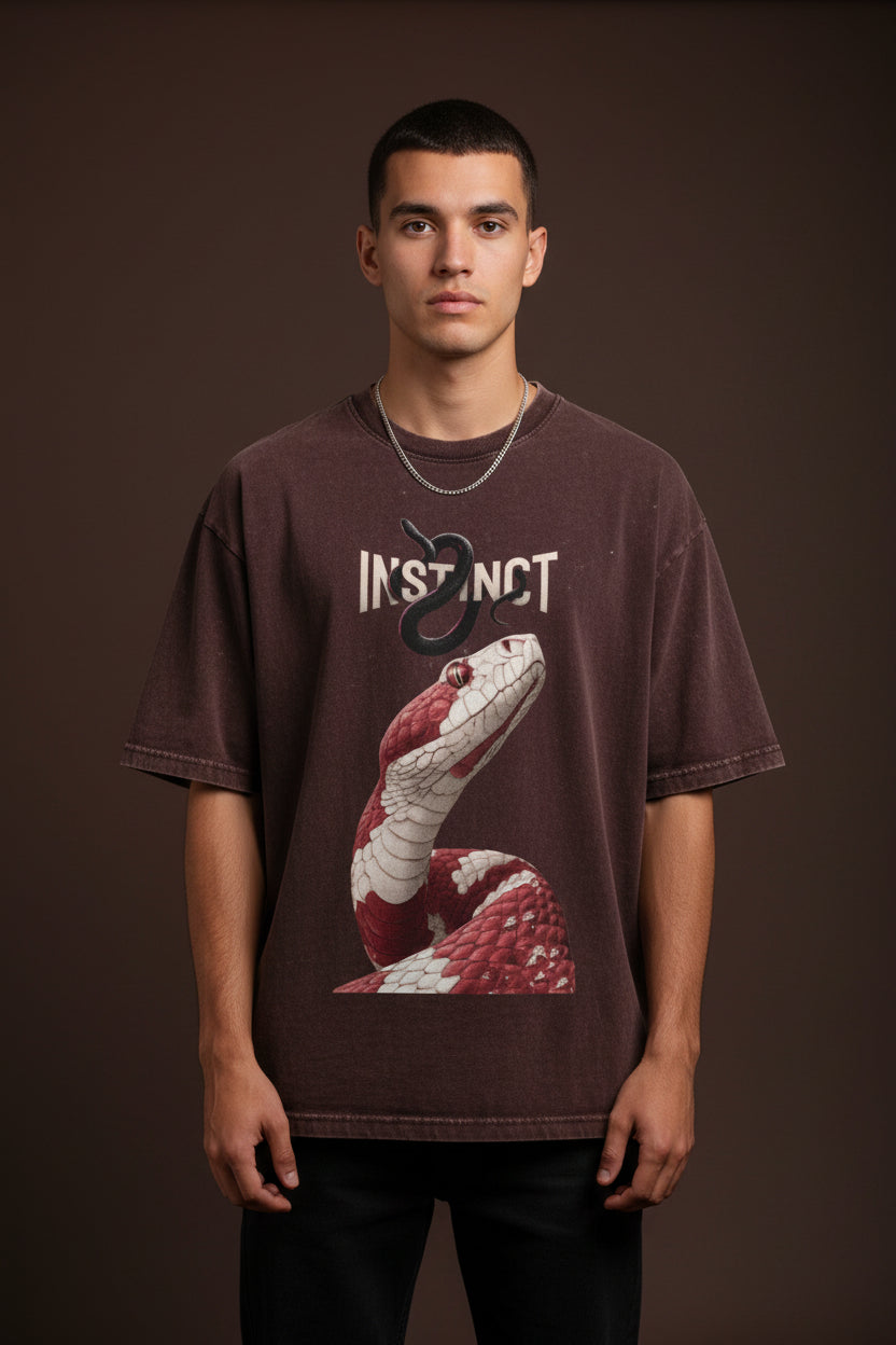 ZotRage Instinct oversized cotton t-shirt in dark acid-washed maroon with a red snake graphic print.