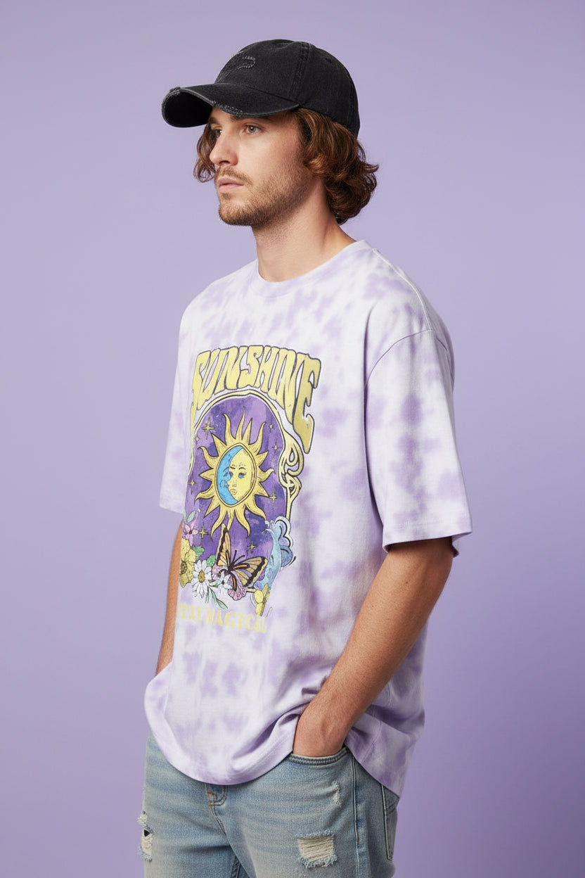 ZotRage oversized white and lavender tie-dye t-shirt featuring a whimsical sun, moon, flower, and butterfly graphic.