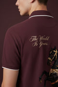 ZotRage maroon cotton polo shirt featuring a rearing black horse graphic and The World Is Yours text on the back