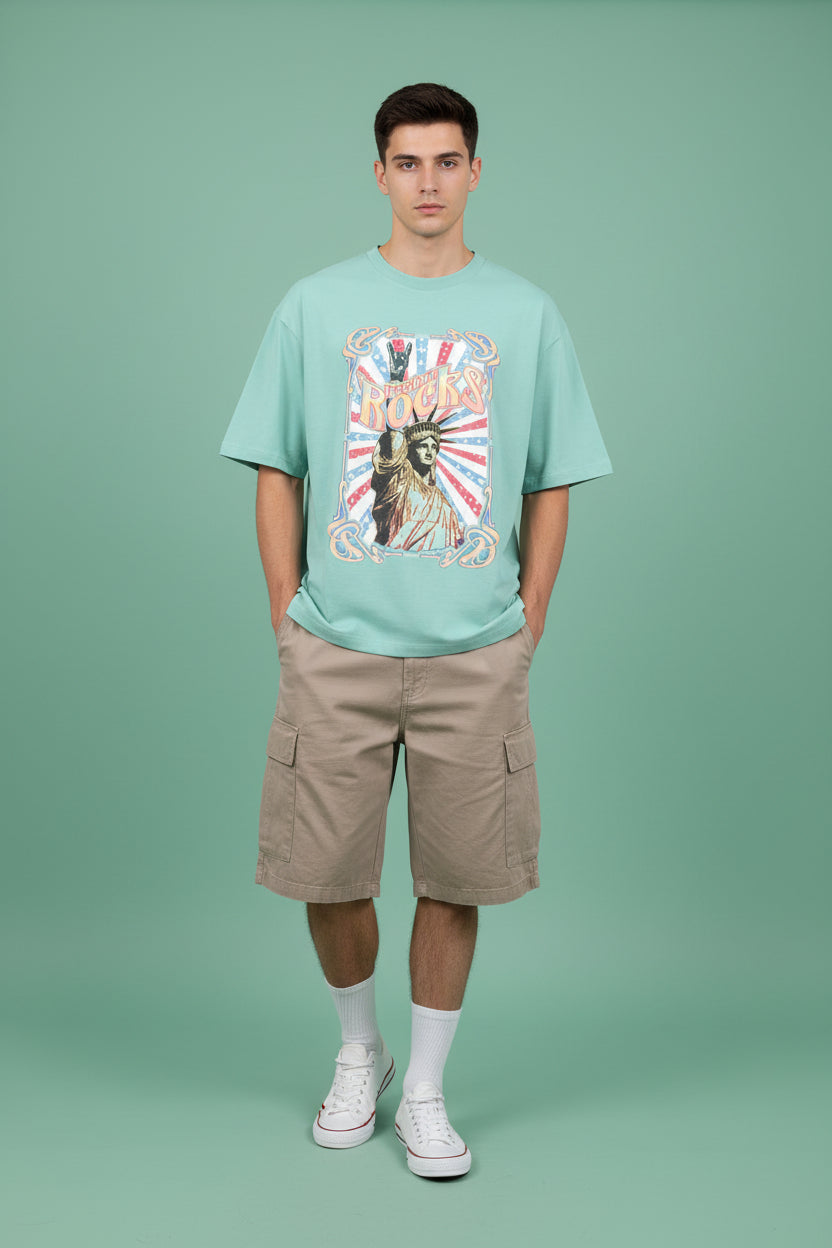 ZotRage mint green oversized cotton t-shirt featuring a vintage Statue of Liberty Freedom Rocks graphic print