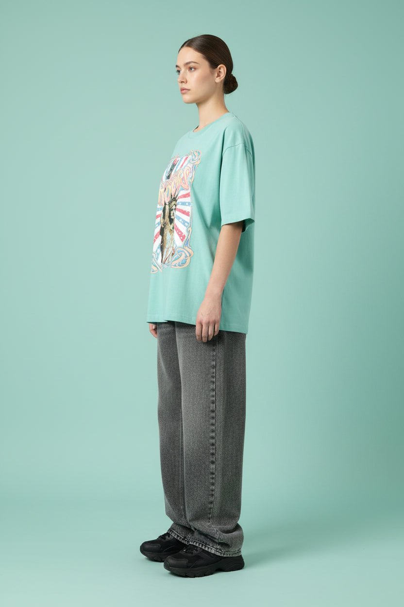 ZotRage mint green heavyweight cotton oversized t-shirt featuring a vintage Statue of Liberty Freedom Rocks graphic