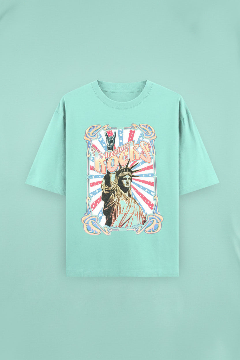 ZotRage mint green heavyweight cotton oversized t-shirt featuring a vintage Statue of Liberty Freedom Rocks graphic.