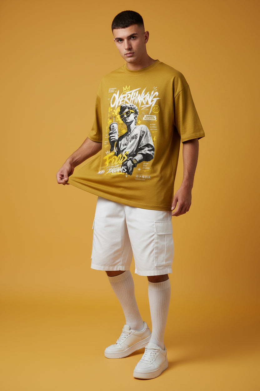 ZotRage mustard yellow oversized cotton t-shirt featuring a graphic print of a statue with sunglasses and text.