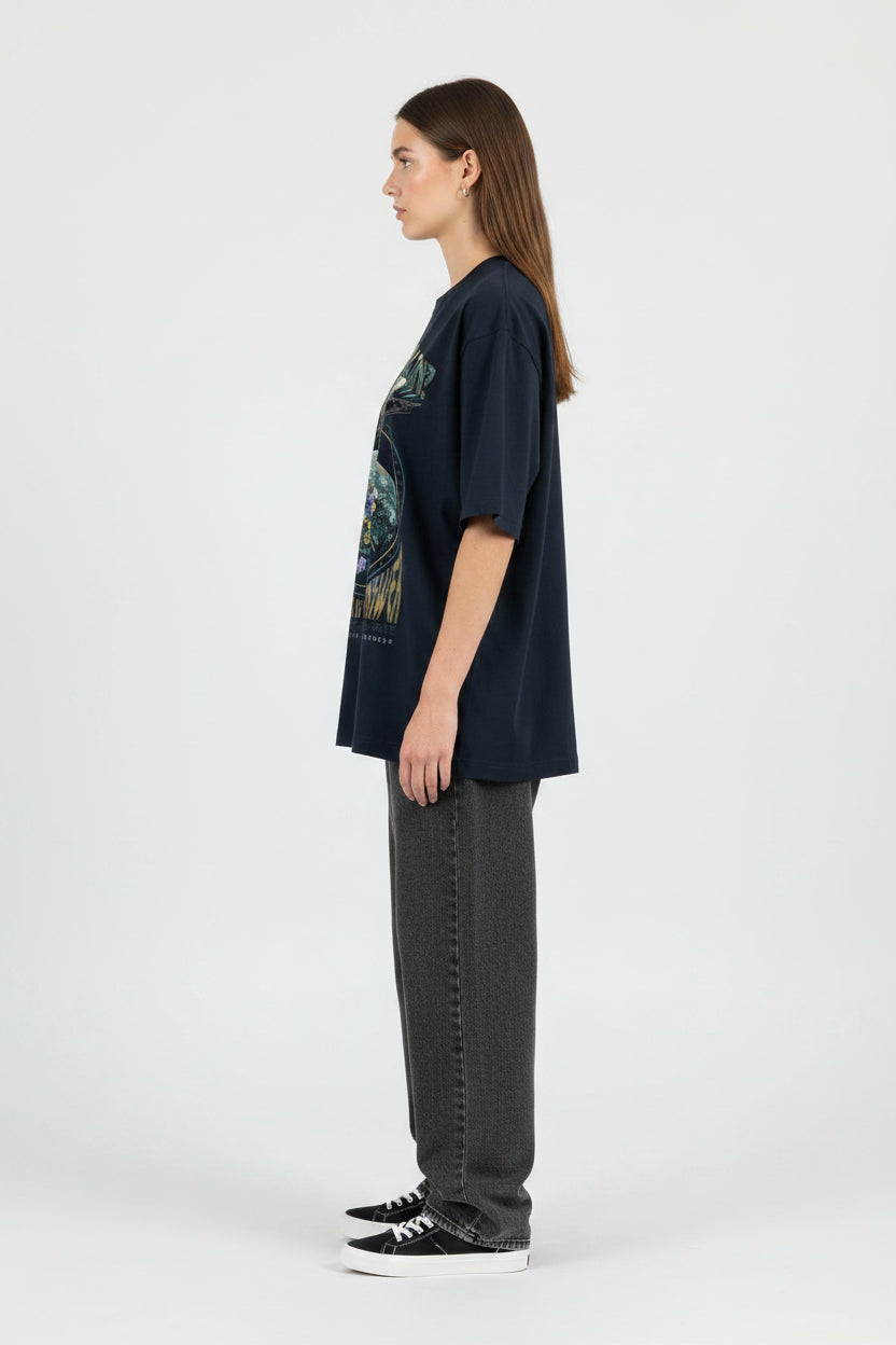 ZotRage navy blue oversized cotton t-shirt featuring a graphic print of a fighter jet over a floral earth design.