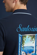 ZotRage navy blue cotton polo shirt featuring a Santorini window view graphic print on the back
