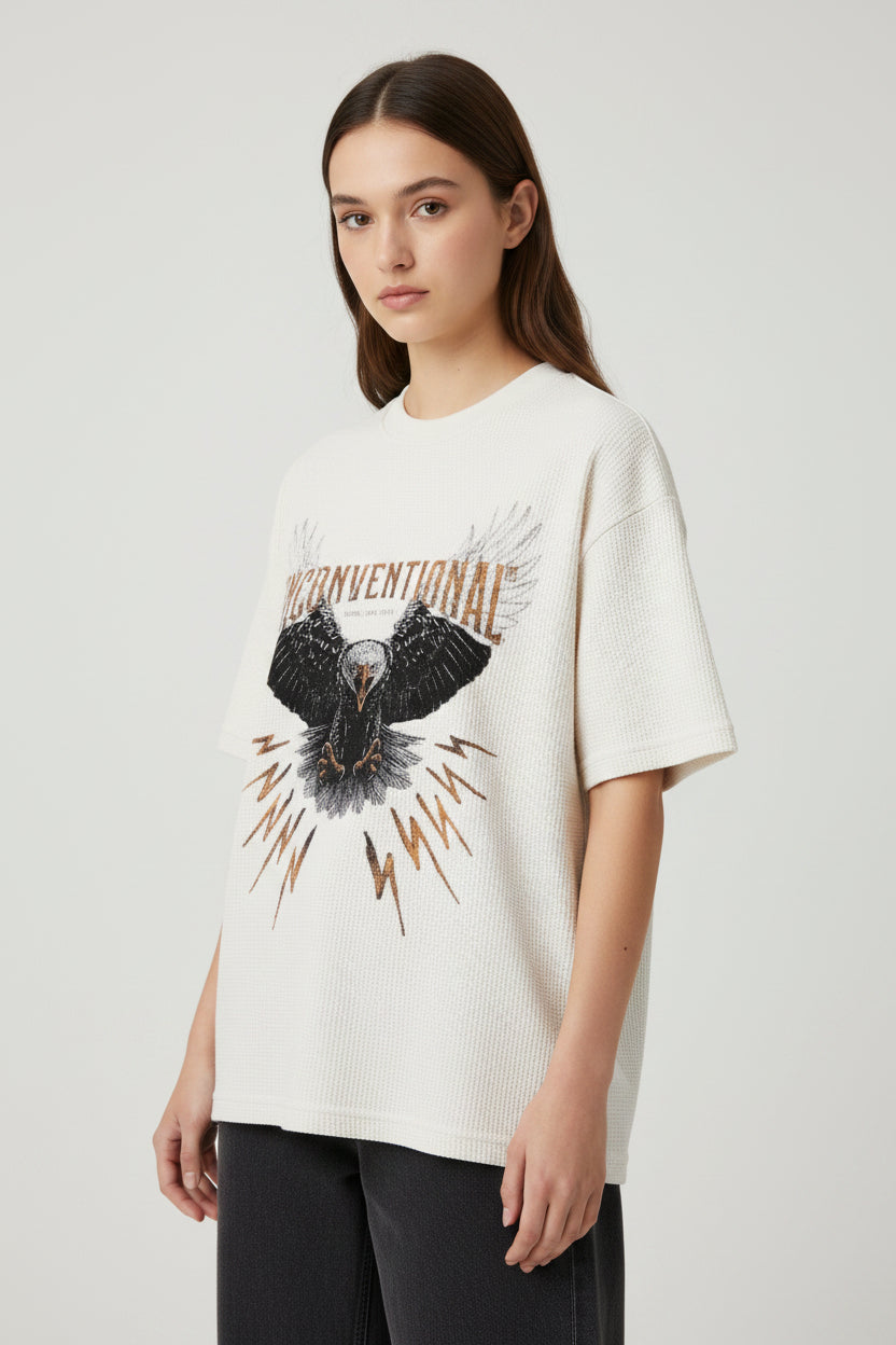 ZotRage off-white waffle knit cotton t-shirt featuring a graphic eagle print and Unconventional text on the chest.