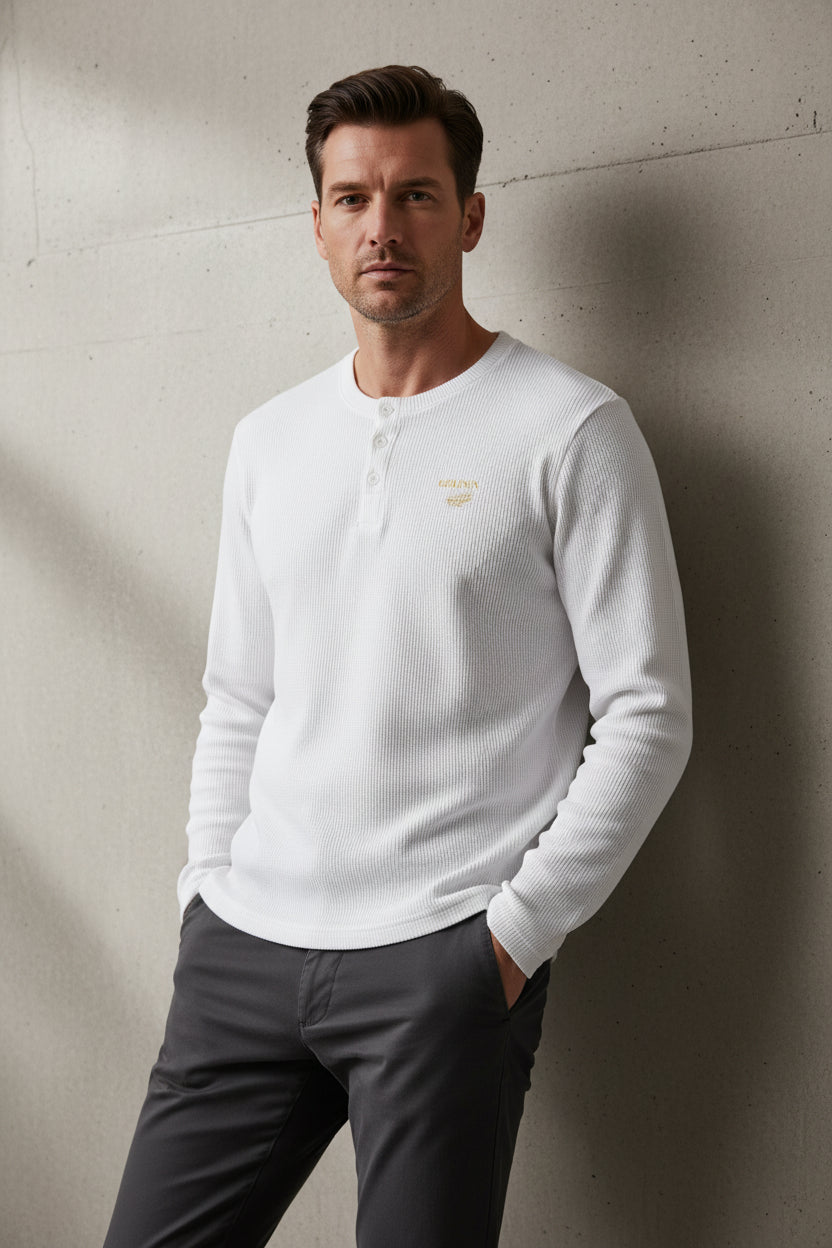 ZotRage off-white waffle knit long-sleeve henley shirt with a small gold embroidered logo on the chest.
