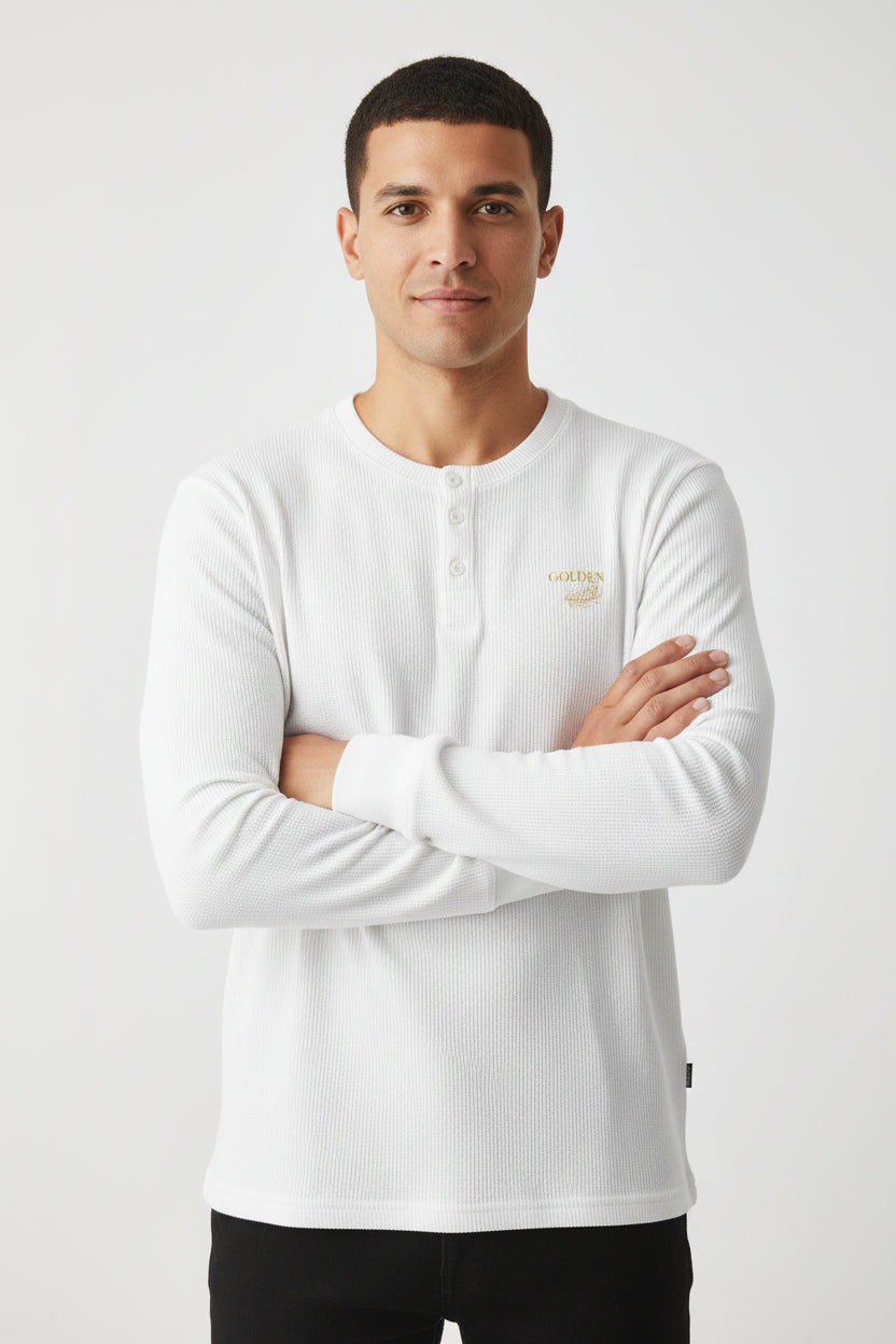 ZotRage off-white waffle knit long-sleeve henley shirt with a small gold embroidered logo on the chest.