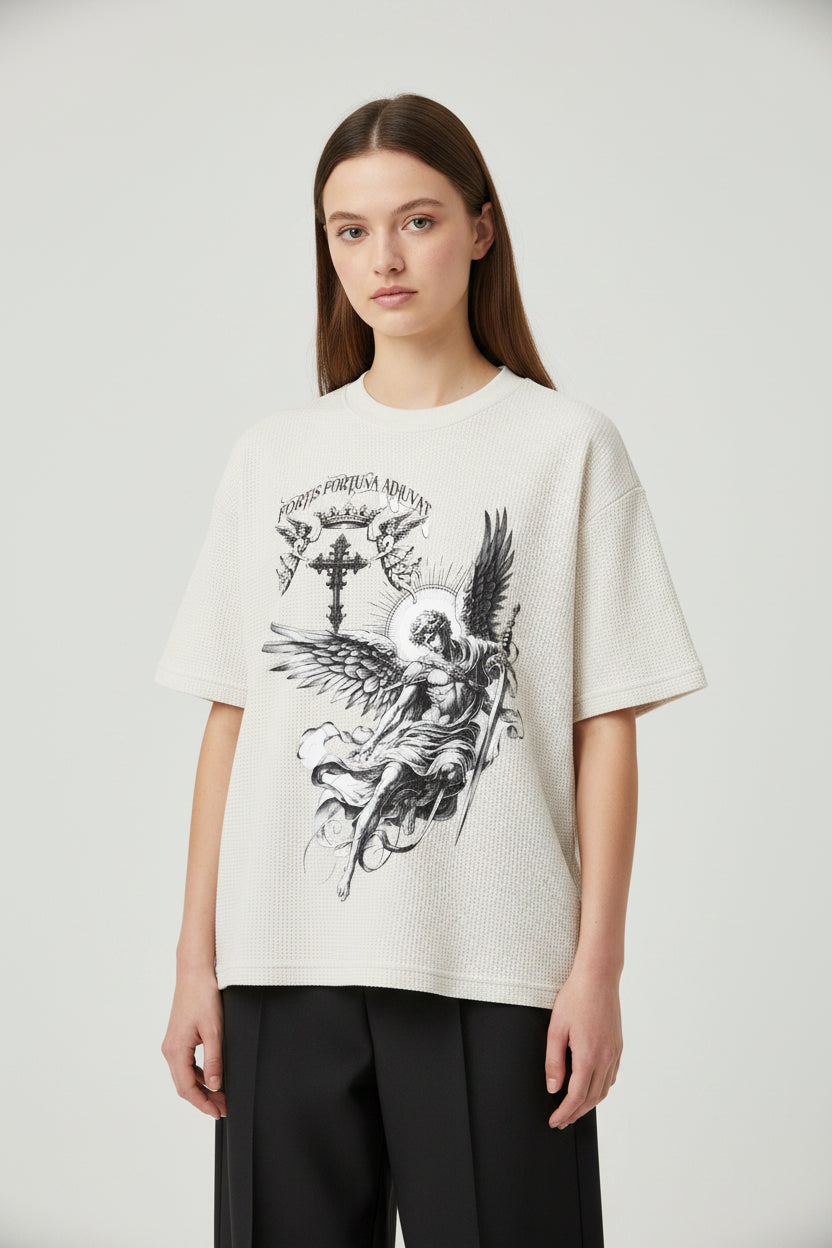 ZotRage off-white waffle knit t-shirt with a detailed black graphic of an angel, sword, and cross on the front.