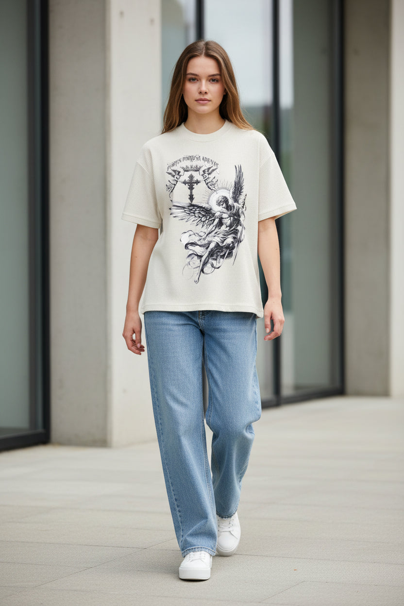 ZotRage off-white waffle knit t-shirt with a detailed black graphic of an angel, sword, and cross on the front.