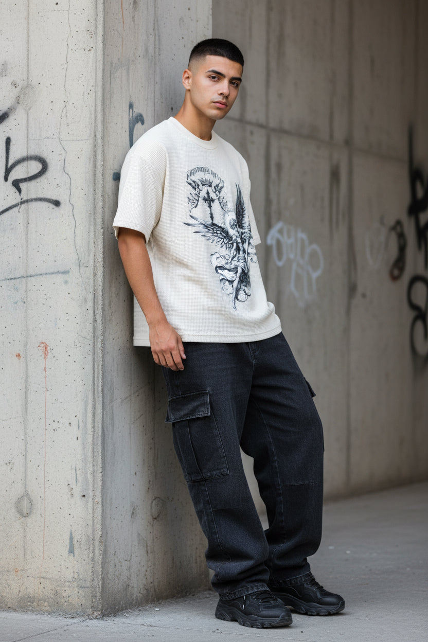 ZotRage off-white waffle knit boxy t-shirt featuring a detailed black graphic of an angel with a sword and cross.