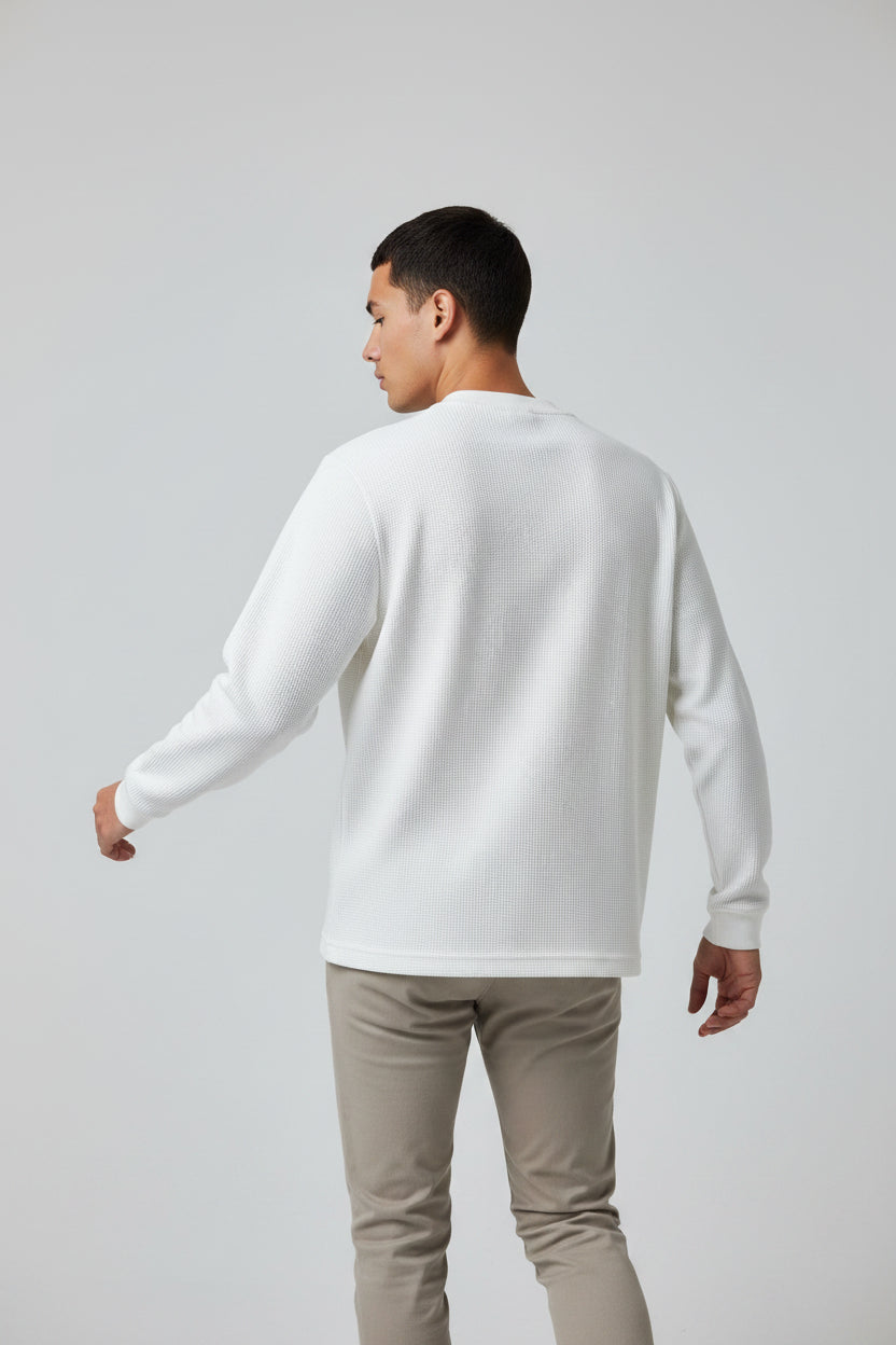 ZotRage off-white waffle knit long-sleeve shirt with a relaxed, oversized fit and textured cotton fabric.