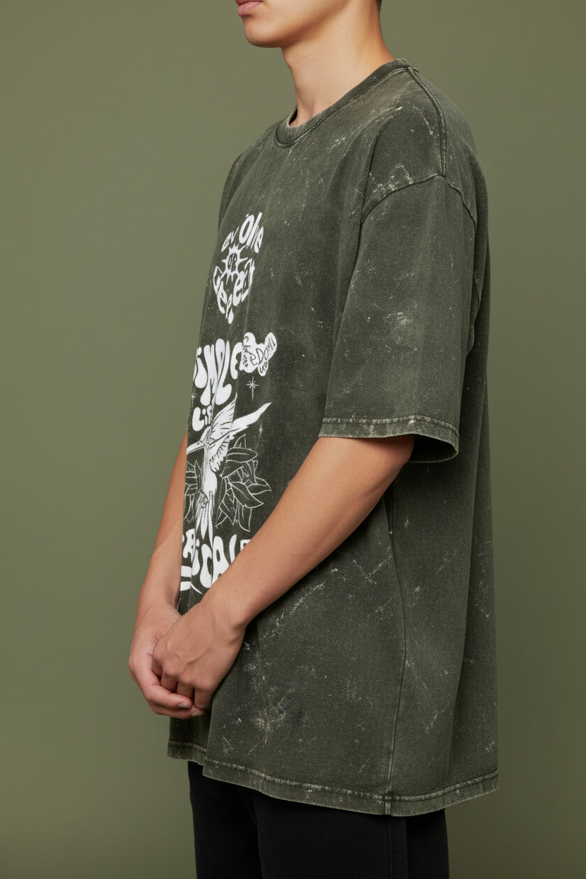 ZotRage olive green acid washed oversized cotton t-shirt with white graphic print featuring a hummingbird design