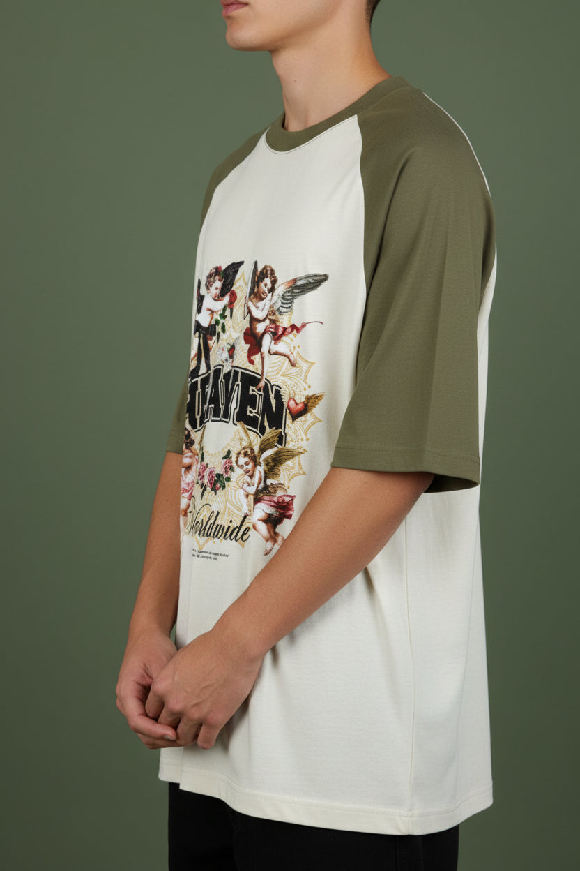 ZotRage olive green and off-white oversized cotton raglan t-shirt with Heaven graphic print and cherub illustrations.