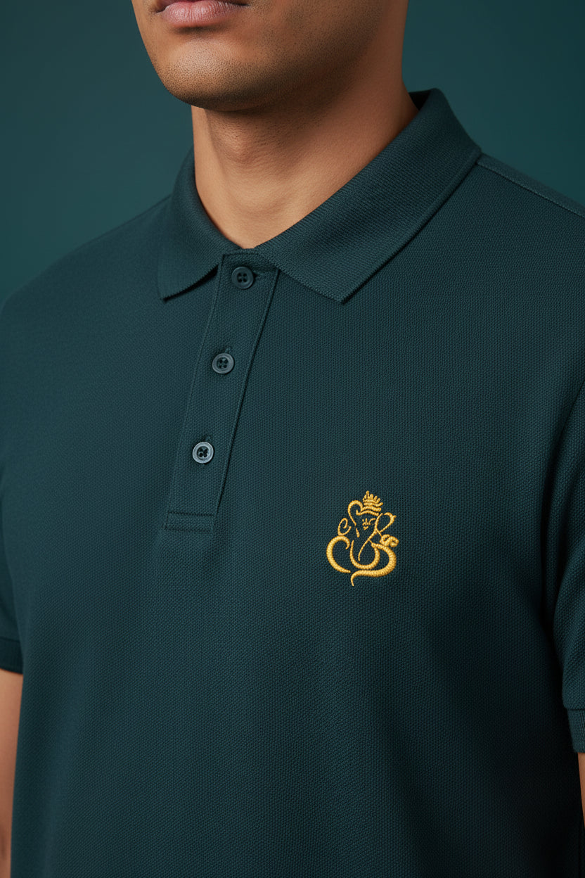 ZotRage petrol blue cotton Airtex polo shirt with a gold Ganesha embroidery on the chest and a structured collar.