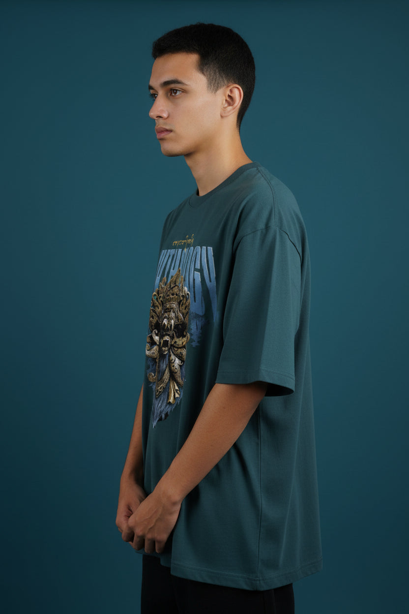 ZotRage petrol blue heavyweight cotton oversized t-shirt featuring a detailed gold Balinese mask graphic print