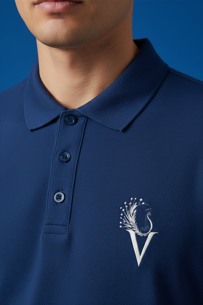 ZotRage royal blue 100% cotton Airtex polo shirt with a structured collar and embroidered peacock logo detail.