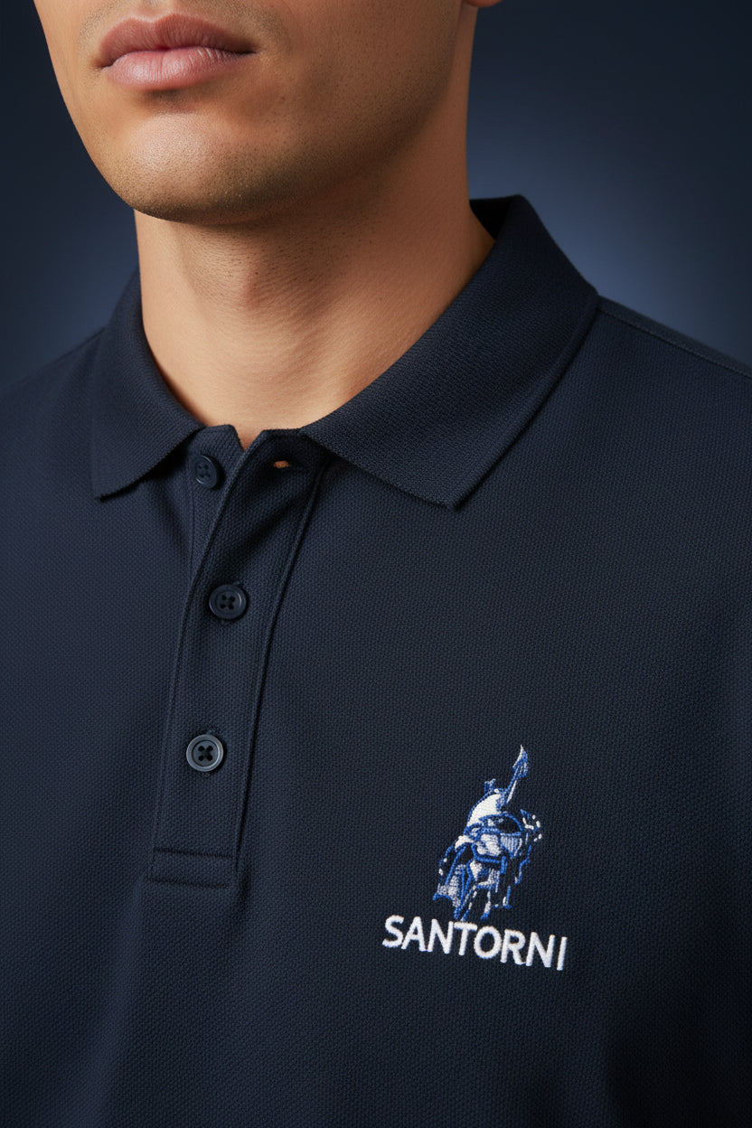 ZotRage Santorini navy blue cotton polo shirt with a textured Airtex finish, structured collar, and chest embroidery.