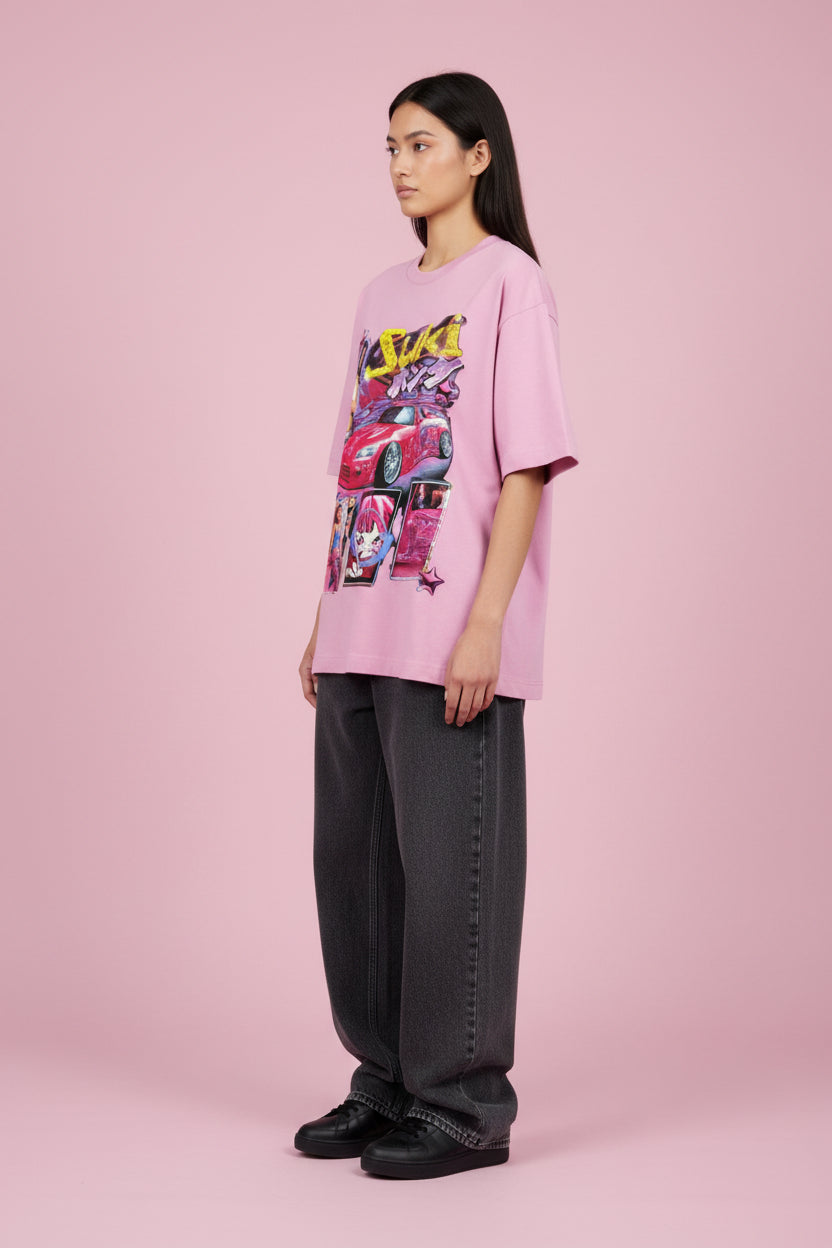 ZotRage Suki baby pink oversized t-shirt featuring a Y2K-inspired graphic print of a pink sports car and character.