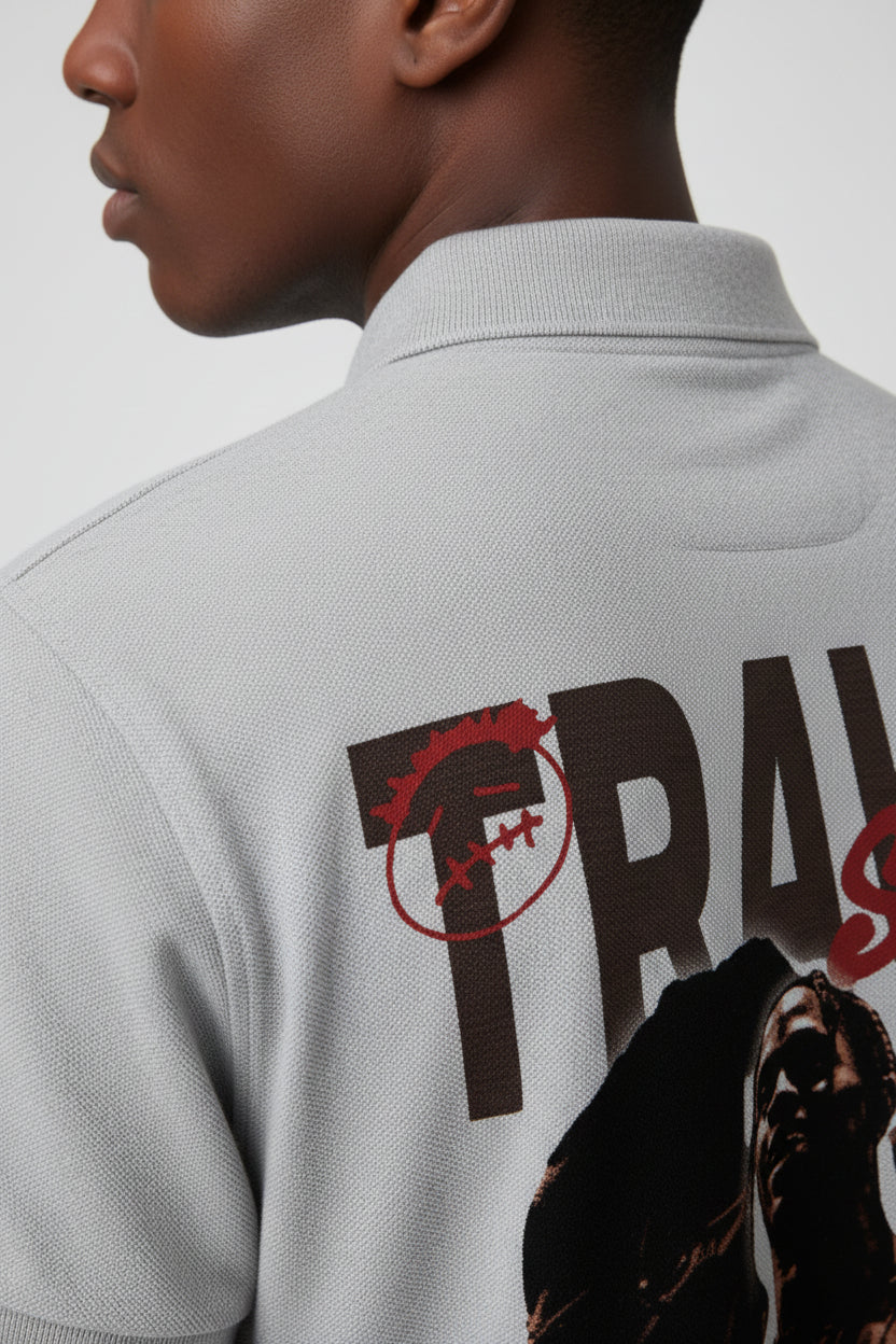 ZotRage grey melange cotton polo shirt featuring a Travis Scott graphic print on the back with a textured finish