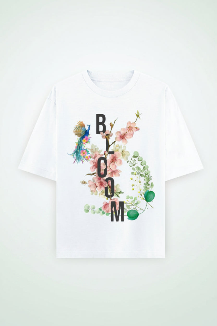 ZotRage white oversized cotton t-shirt featuring a floral Bloom graphic with a peacock and botanical elements.