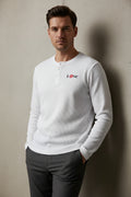 ZotRage off-white waffle knit henley shirt with long sleeves and Love graphic featuring a red kiss print